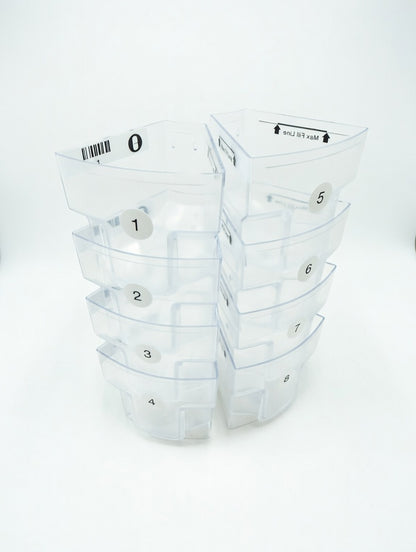 Set of clear plastic MedaCube bin containers with numbered labels on a white background