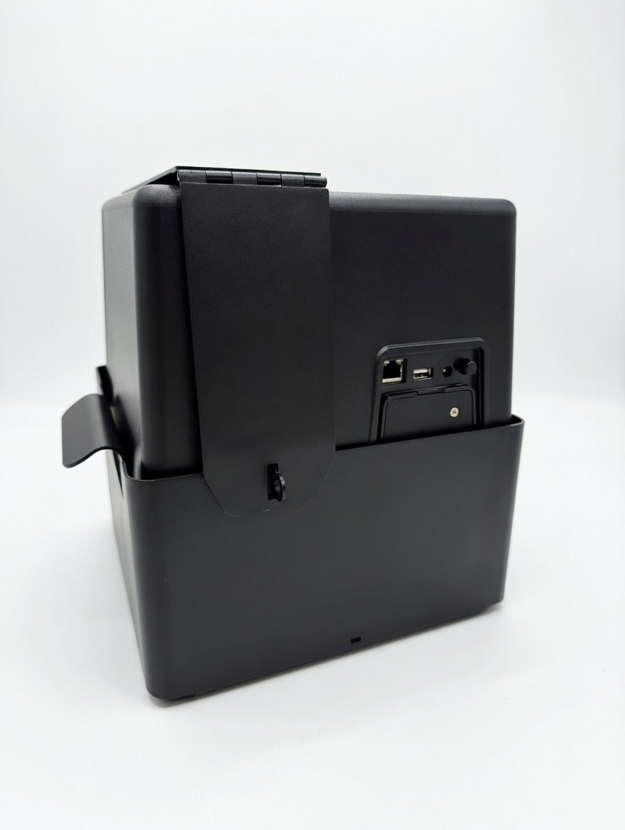 Reverse view of the back of a MedaCube device as it sits in black MedaCube metal security case. Shows area for lock.